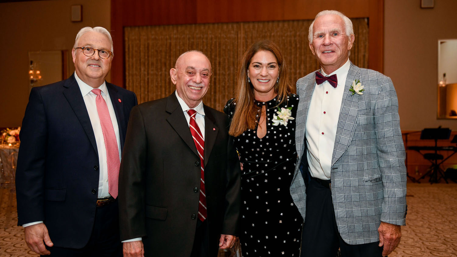 From left: Chancellor Randy Woodson and College of Engineering Dean Louis Martin-Vega with Deb and Ed Fitts, recipients of the 2019 Darrell and Carolyn Menscer Cup.