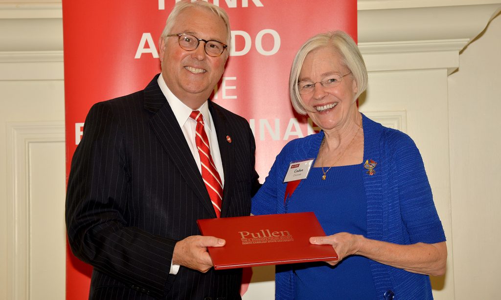 A Pullen Society member being recognized by Chancellor Woodson with a Pullen Society certificate