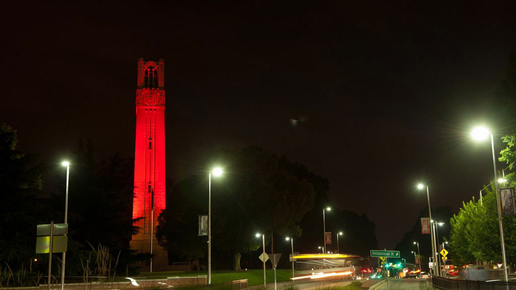 the belltower lit with red color at night