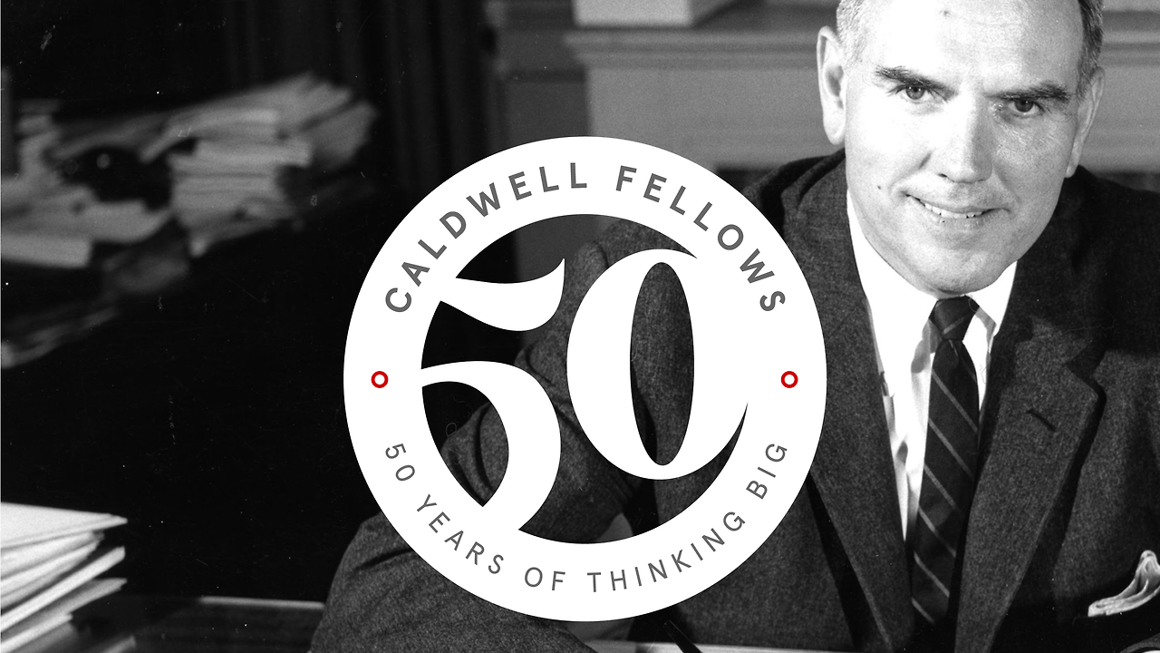 John Caldwell with a Caldwell Fellows logo.