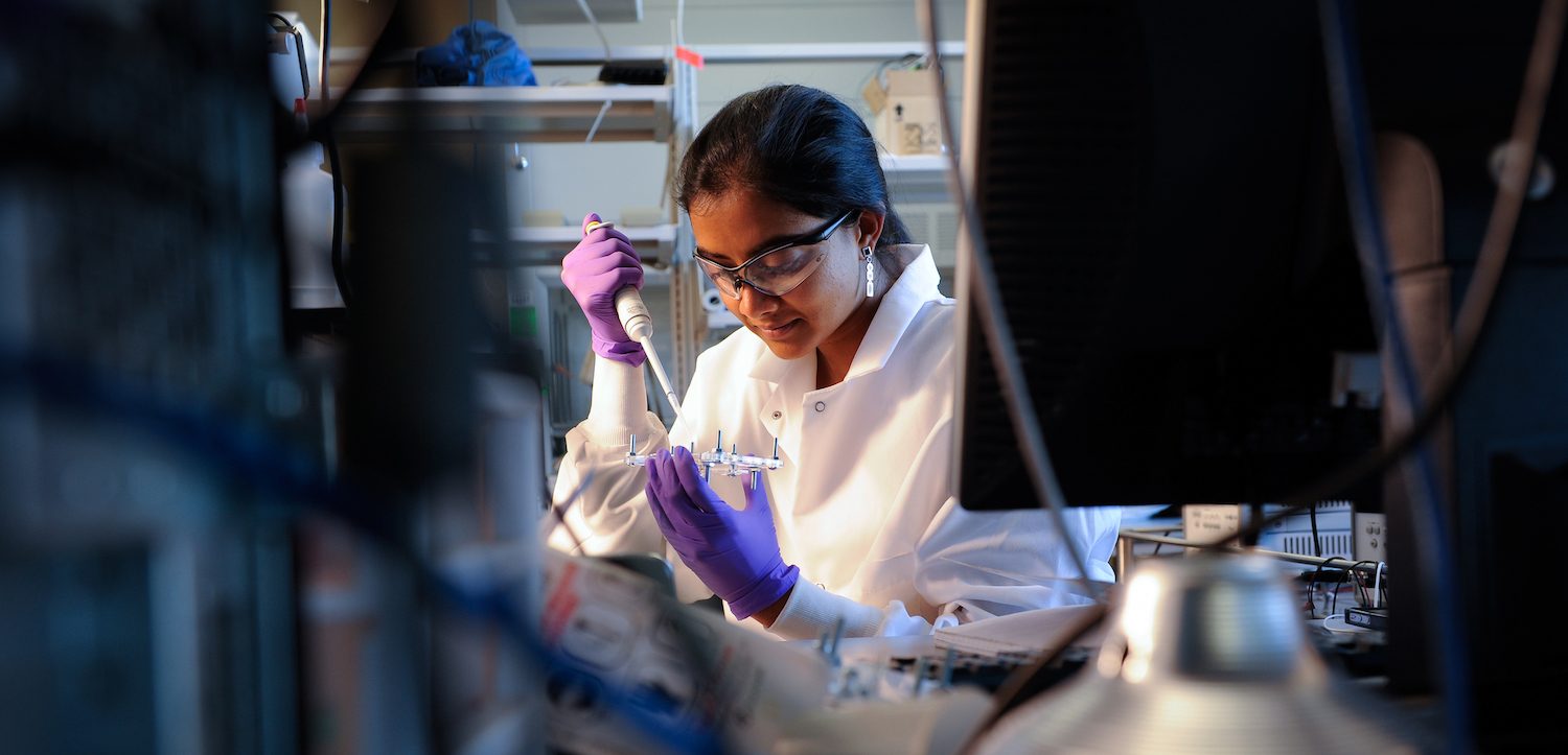 Biomedical engineering PH.D. graduate student Vindhya Kunduru working in a biomedical engineering lab.
