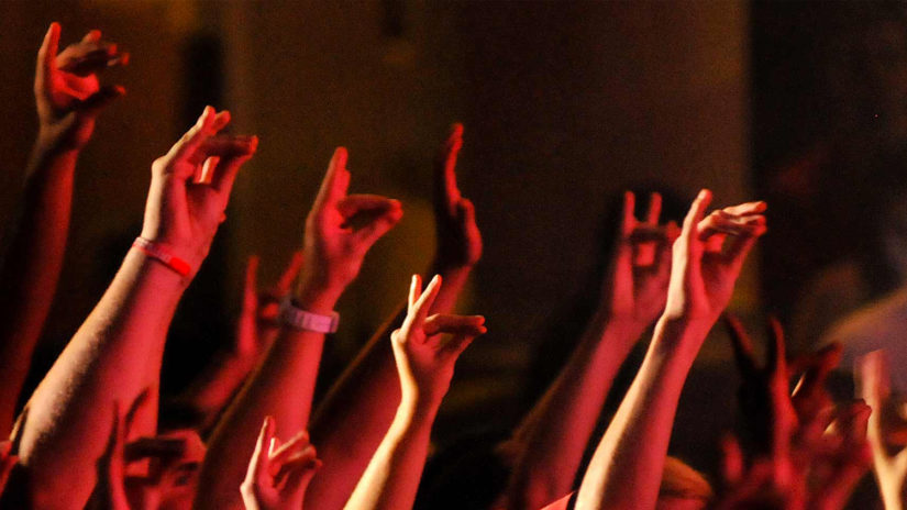 Wolf hands raised high during red and white week