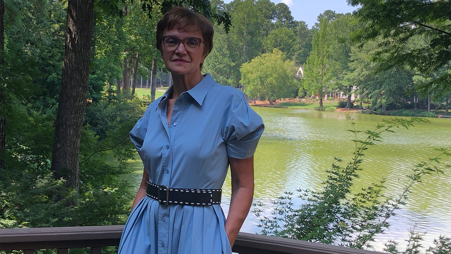 Pascale Meyran posing in front of a lake