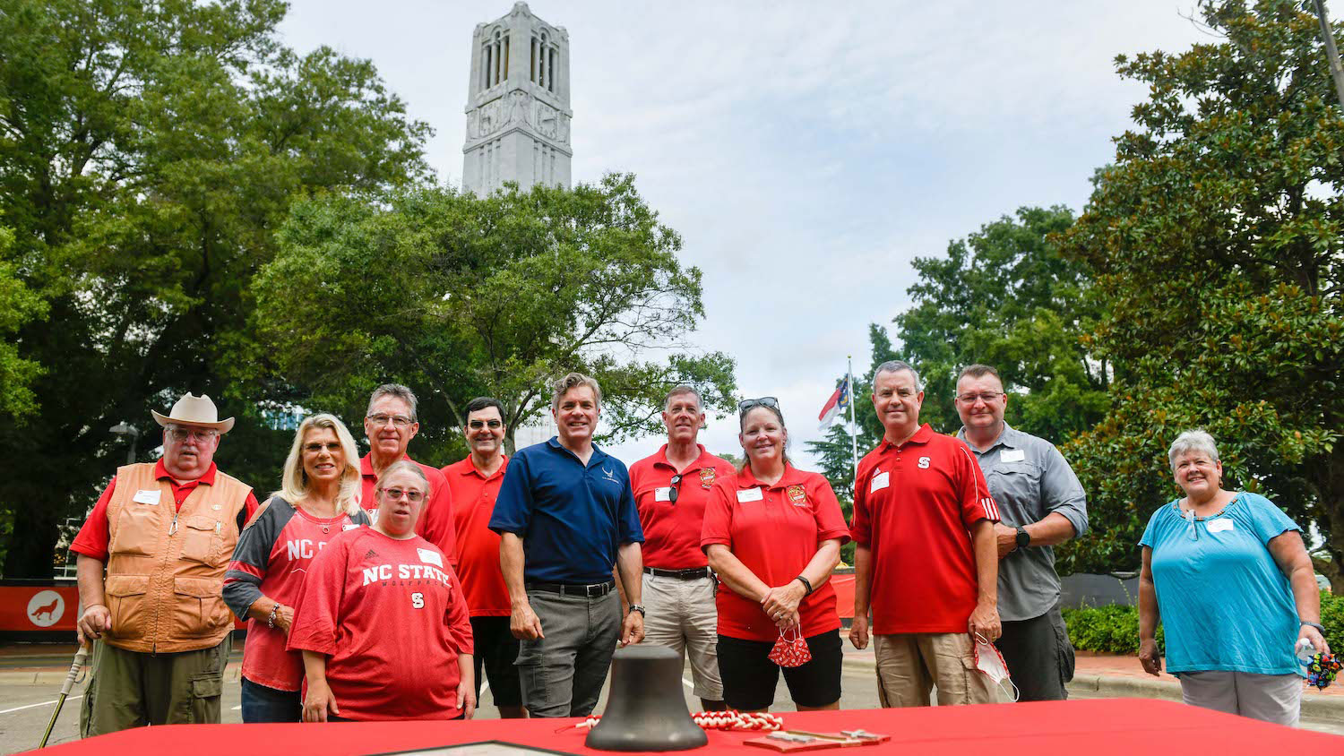 Marching Cadets and their families and friends reunite at the Memorial Belltower to celebrate the arrival of the fraternity&rsquo;s special bell