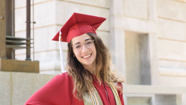 closeup of Lara Rabinowitz in her cap and gown at the belltower