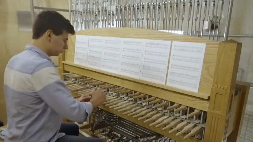 Tom Gurin playing on a carillon the inaugural performance at the May 14 Belltower ceremony