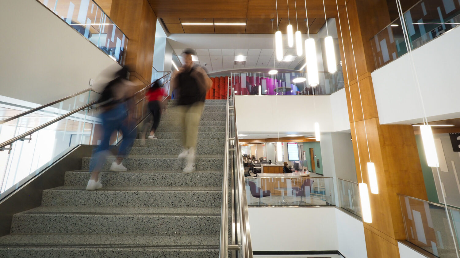 Students making their way on the stairway in the DH Hill Jr Library.