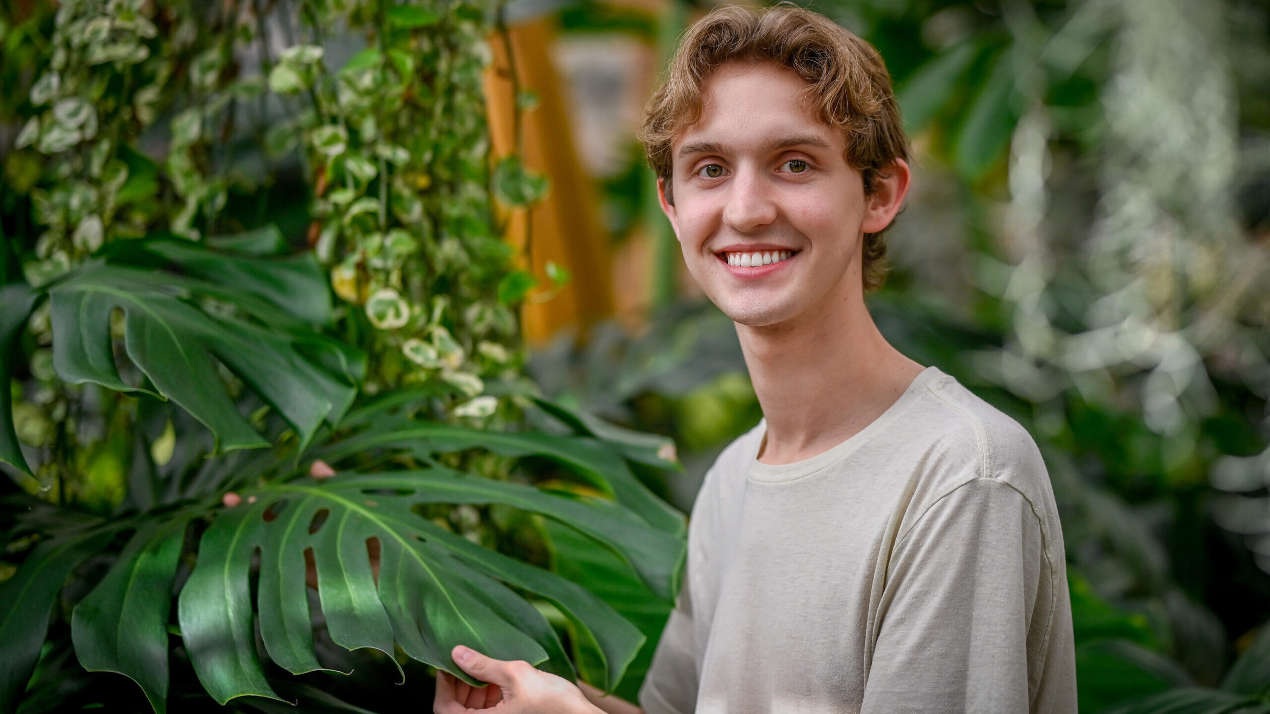 Brady Farlow posing among plants
