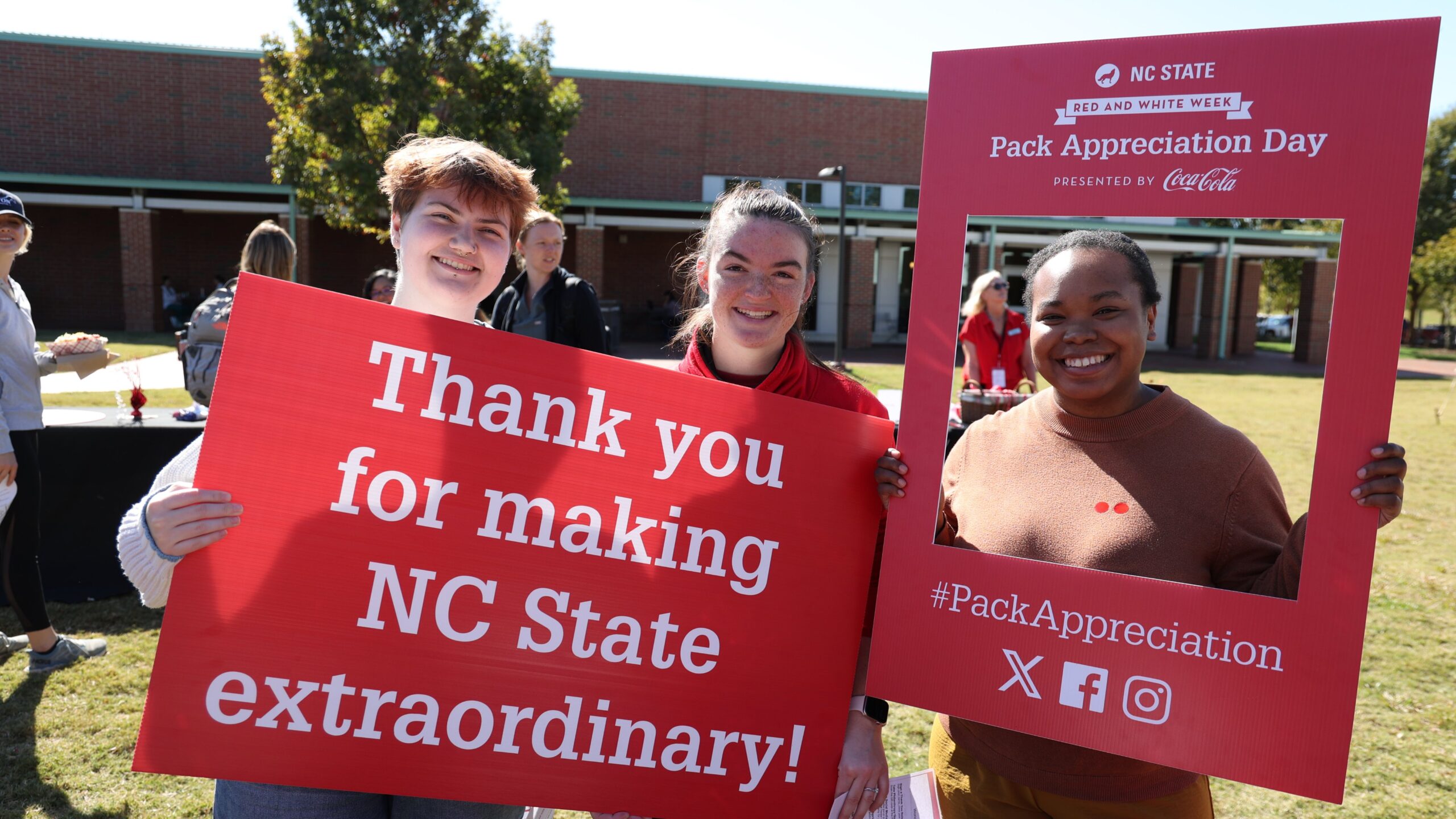 CVM students hold Pack Appreciation Day signs