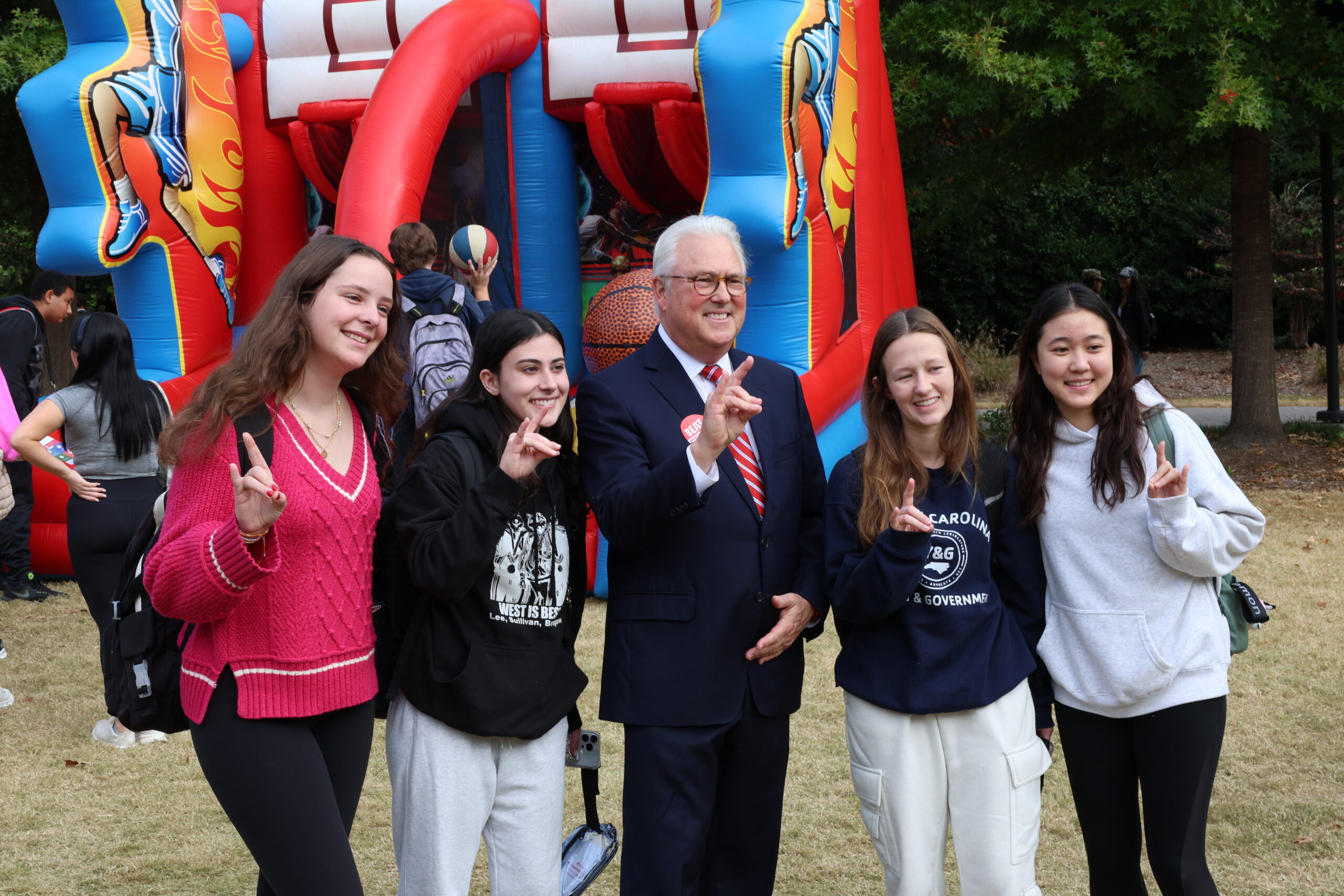 Chancellor Woodson posing with students.