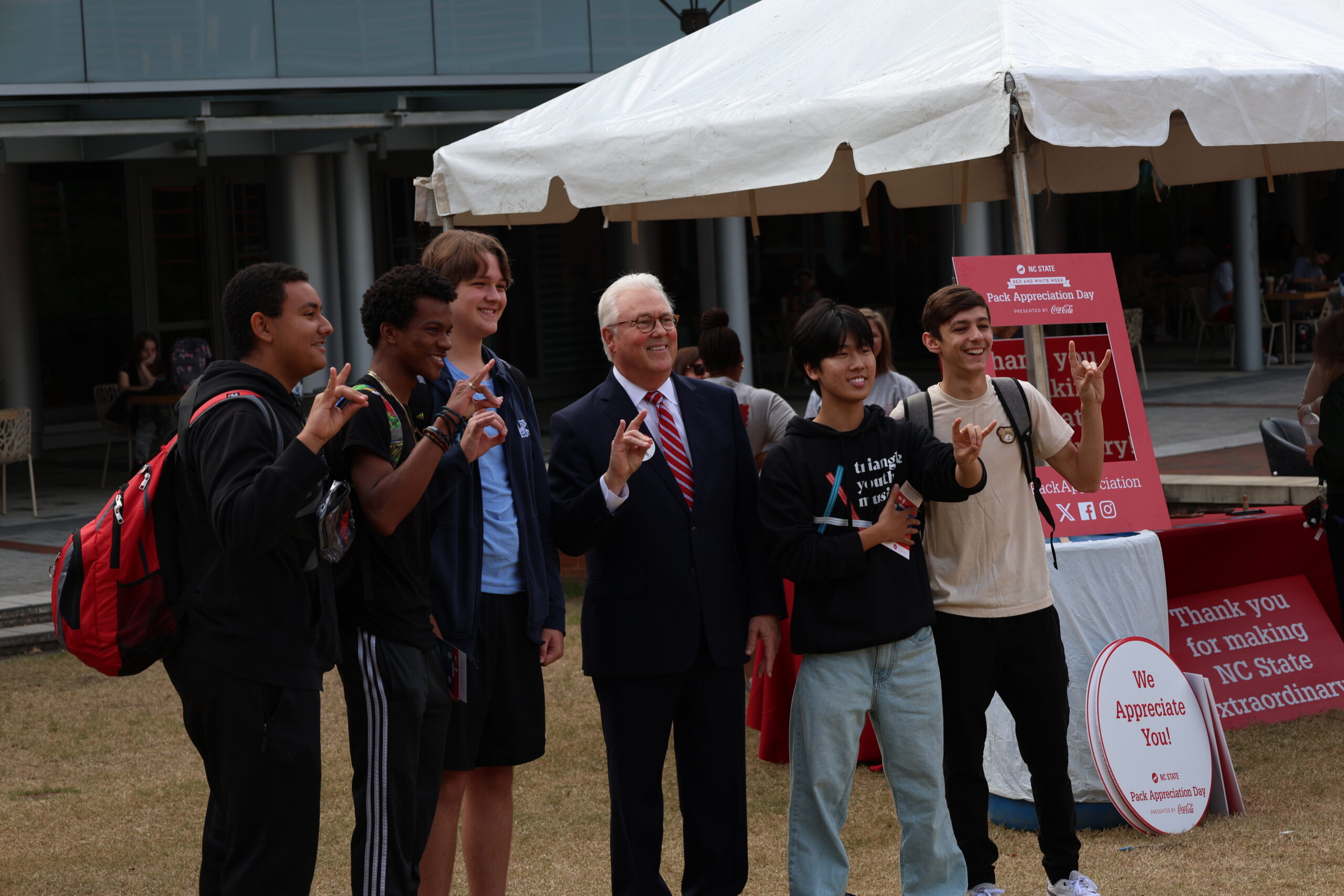 Chancellor Woodson posing with students