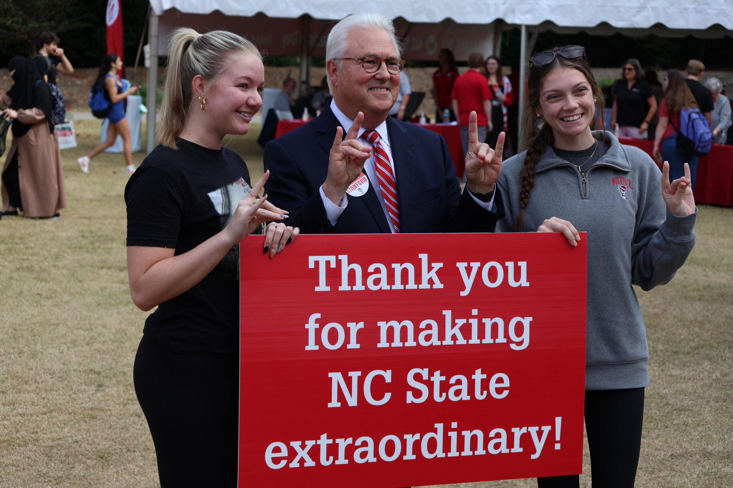 Chancellor Woodson posing with students.