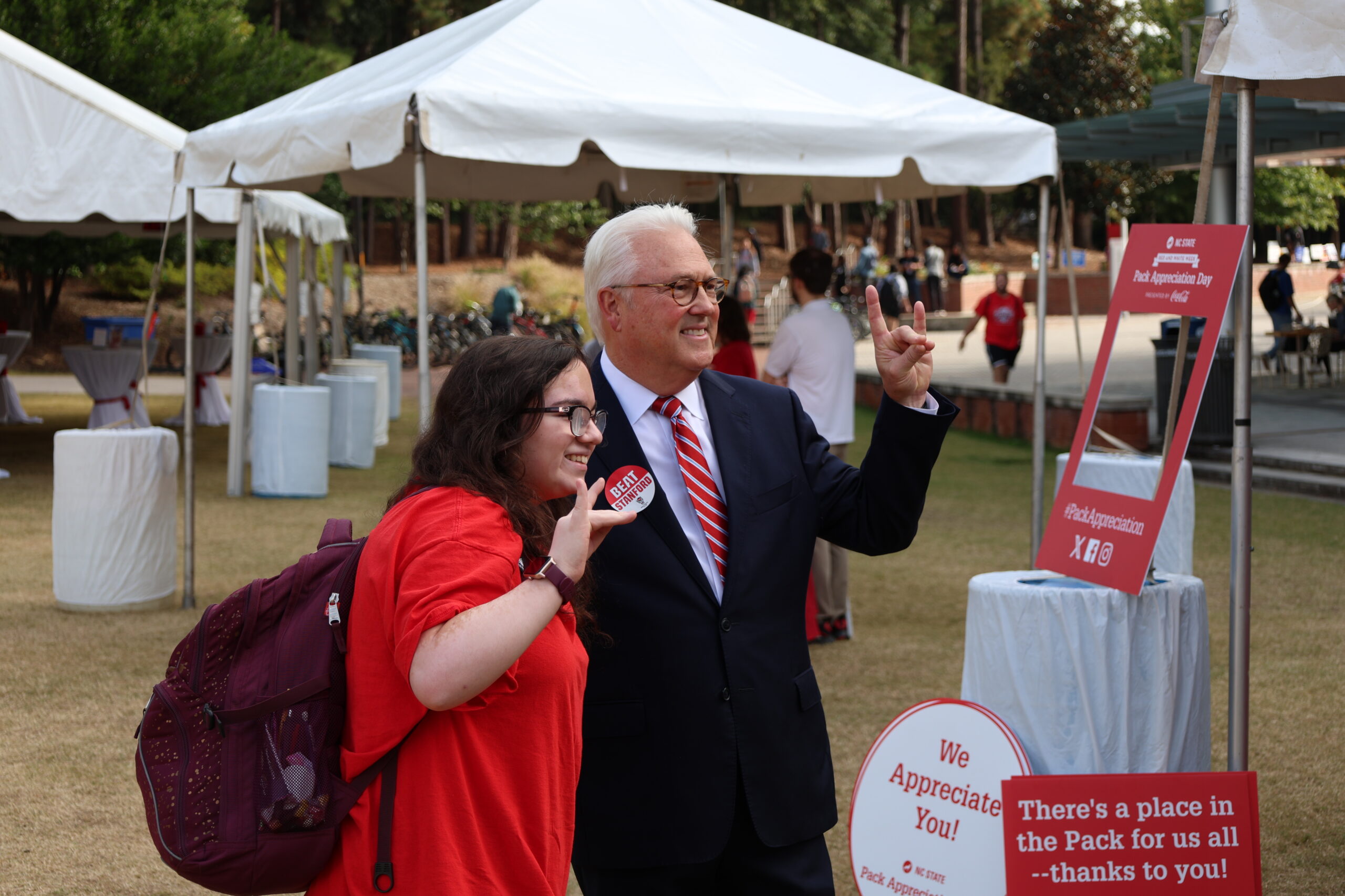 a student posing with the chancellor