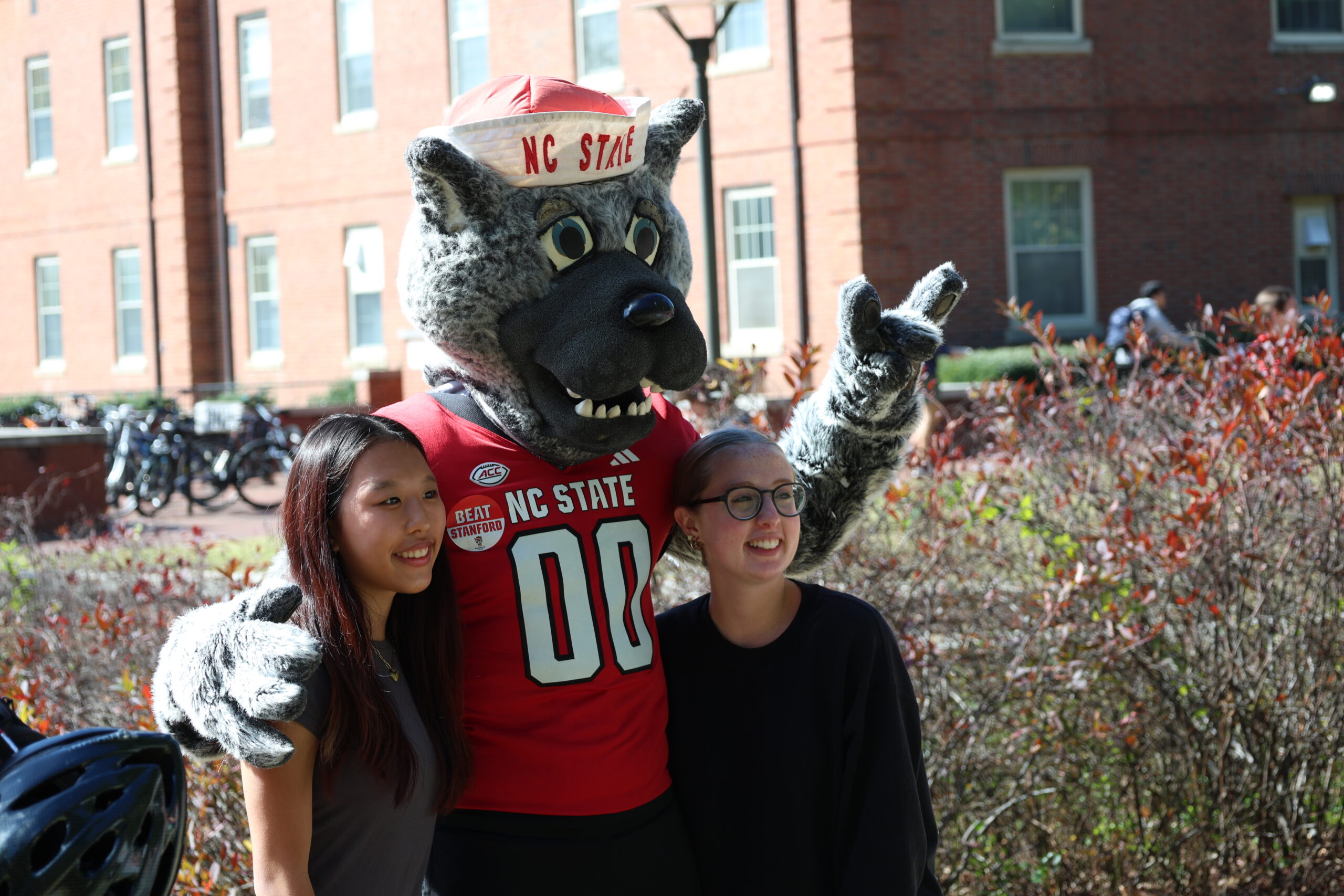 students posing with Mr. Wuf