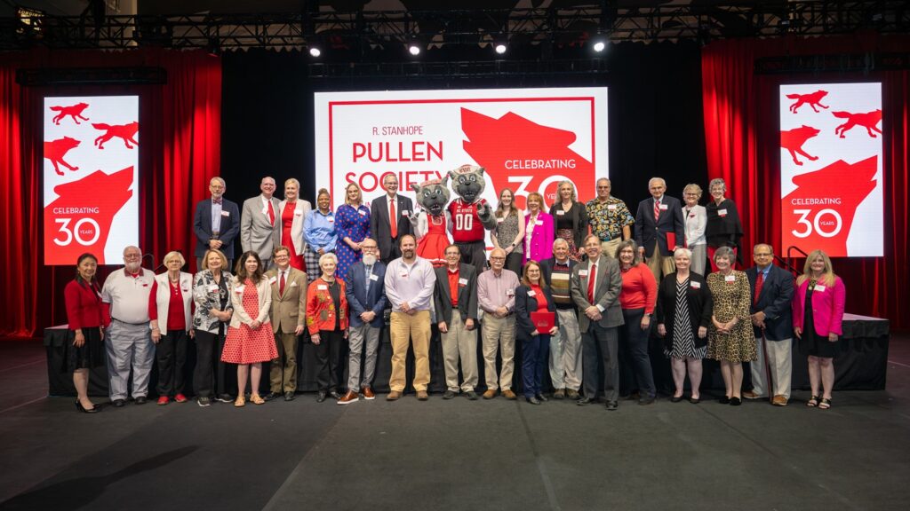 Members of the 2024 Pullen Society induction class join for a group photo, complete with Mr. and Ms. Wuf, following this year’s induction ceremony. Photos by Marc Hall