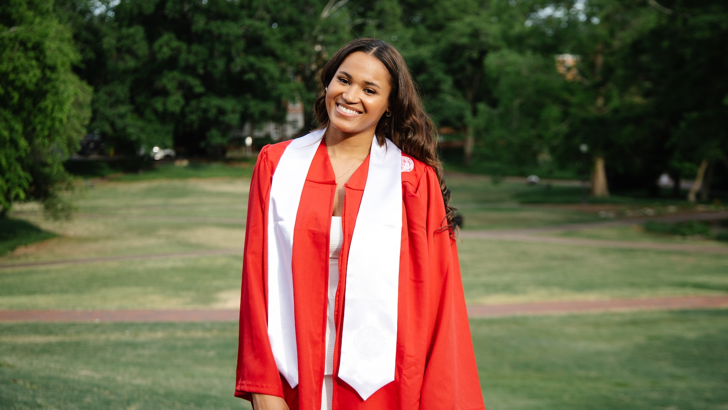 Kassidy Oliphant in red graduation gown with white sash